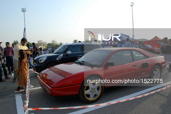 People visit a car show in Islamabad, capital of Pakistan on Oct. 23, 2016. The Islamabad Auto Show 2016, orchestrated by PakWheels, made a...