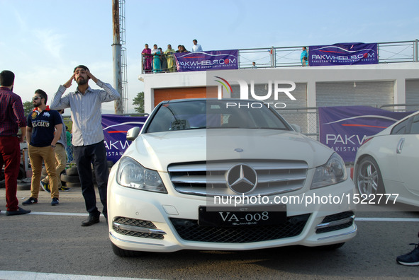 People visit a car show in Islamabad, capital of Pakistan on Oct. 23, 2016. The Islamabad Auto Show 2016, orchestrated by PakWheels, made a...