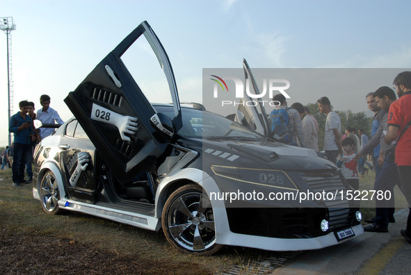 People visit a car show in Islamabad, capital of Pakistan on Oct. 23, 2016. The Islamabad Auto Show 2016, orchestrated by PakWheels, made a...