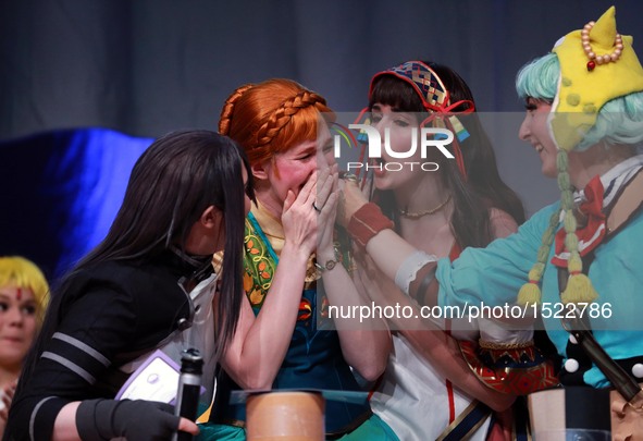 Cosplay winners celebrate during the finale of the German Cosplay Championship in Frankfurt, Germany, on Oct. 23, 2016. The finale of the 10...