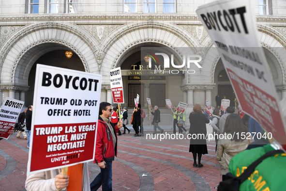 People protest in front of the Trump International Hotel in Washington, D.C., the United States on Oct. 26, 2016. The opening and ribbon cut...