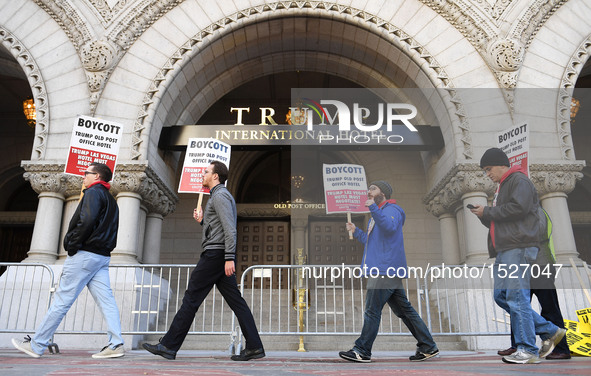 People protest in front of the Trump International Hotel in Washington, D.C., the United States on Oct. 26, 2016. The opening and ribbon cut...