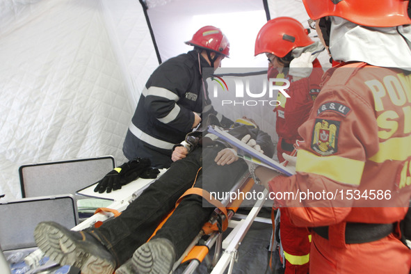 Firefighters and medical emergency staff take part in a rescue operation during an earthquake exercise held in Bucharest, Romania, Nov. 1, 2...