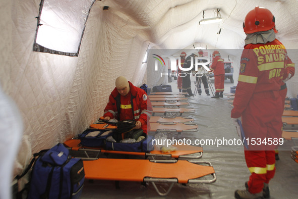 Medical emergency staff set up a temporary tent during an earthquake exercise held in Bucharest, Romania, Nov. 1, 2016.   