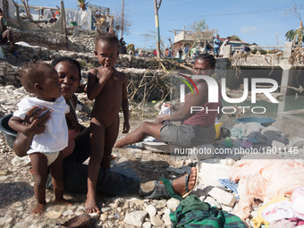 Women and children wash in the river after hurricane Matthew destroyed and flooded their houses, on October 7, 2016. Hurricane Matthew kille...