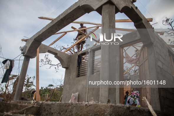 Residents have started to repair their damaged houses in village on Tapyon near Les Cayes, Haiti, on October 9, 2016.The number of people ki...