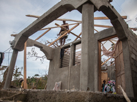 Residents have started to repair their damaged houses in village on Tapyon near Les Cayes, Haiti, on October 9, 2016.The number of people ki...