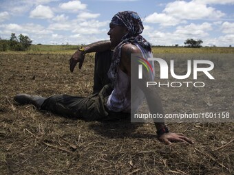 Guerrillas from FARC EP rest from their daily labours with a soccer game in Llanos del Yari, a town in an Indigenous region of southern Colo...