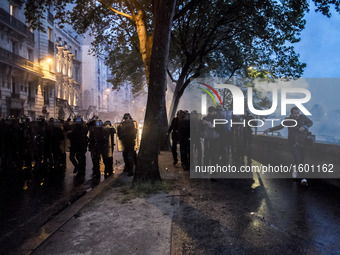 Protesters clash with anti-riot police during a demonstration against the use of the French constitution's Article 49,3, allowing the govern...