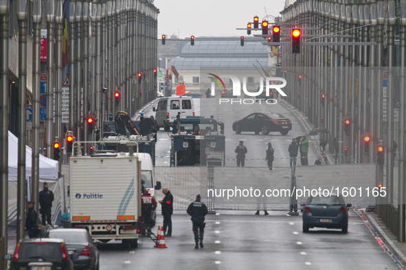 A security perimeter fence stands on Wetstraat in Brussels, Belgium, on March 23, 2016. Police continue investigations after yesterday's exp...