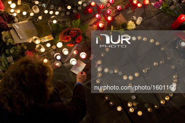 People gather in Paris, on March 22, 2016, for a tribute to the victims of Brussels following triple bomb attacks in the Belgian capital tha...