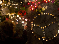 People gather in Paris, on March 22, 2016, for a tribute to the victims of Brussels following triple bomb attacks in the Belgian capital tha...