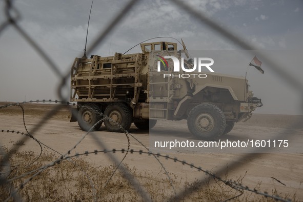 An Iraqi Mine-Resistan Ambush Protected vehicle, or MRAP, along the frontline in Makhmour, Iraqi, on May 18, 2016. Makhmour, having been lib...