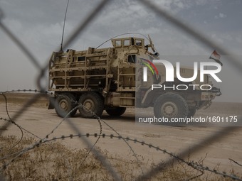 An Iraqi Mine-Resistan Ambush Protected vehicle, or MRAP, along the frontline in Makhmour, Iraqi, on May 18, 2016. Makhmour, having been lib...