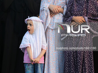 Palestinians attend the morning prayers for Eid al-Fitr celebrations, which marks the end of the holy fasting month of Ramadan, in Gaza City...