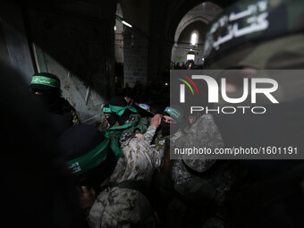 Mourners carry the bodies of one of the seven Palestinian Hamas gunmen who were killed when a tunnel collapsed close to the Gaza Strip's eas...