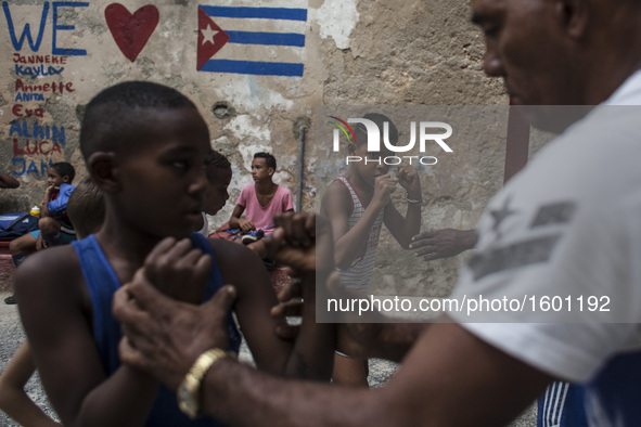 Boxing children in Havana, Cuba, on 10 December 2016. In a ruined gym, literally collapsed, train a large group of children from 9 years old...