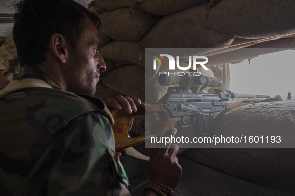 Sniper watching for ISIS movement in the villages on the roots of Bashiqa mountain , on October 25, 2016. The Kurdish forces of Peshmerga ha...