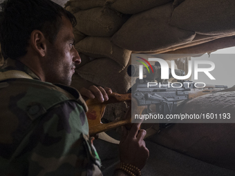 Sniper watching for ISIS movement in the villages on the roots of Bashiqa mountain , on October 25, 2016. The Kurdish forces of Peshmerga ha...