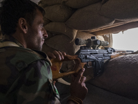 Sniper watching for ISIS movement in the villages on the roots of Bashiqa mountain , on October 25, 2016. The Kurdish forces of Peshmerga ha...