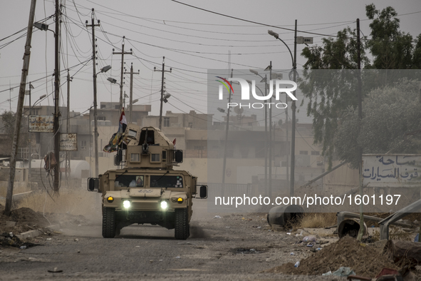 Iraqi forces patrolling the roads of the Assyrian village of Karemlesh, on October 28, 2016 in Karemlesh, Iraq. Karemlesh village was libera...