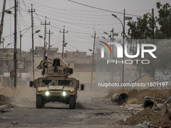 Iraqi forces patrolling the roads of the Assyrian village of Karemlesh, on October 28, 2016 in Karemlesh, Iraq. Karemlesh village was libera...