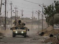 Iraqi forces patrolling the roads of the Assyrian village of Karemlesh, on October 28, 2016 in Karemlesh, Iraq. Karemlesh village was libera...