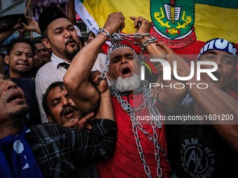 A Rohingya Muslim in Malaysia chain himself during  'Stop the Oppression of  Rohingya' assembly outside Myanmar Embassy in Kuala Lumpur on N...