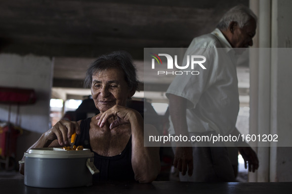 Occasionally Mr. José Receives a visit from his family, but he said it is very rare que this to happen. In this photo Rosalia Maria, wife of...