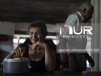 Occasionally Mr. José Receives a visit from his family, but he said it is very rare que this to happen. In this photo Rosalia Maria, wife of...