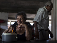 Occasionally Mr. José Receives a visit from his family, but he said it is very rare que this to happen. In this photo Rosalia Maria, wife of...