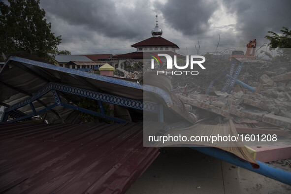 A collapsed mosque minaret is seen after a 6.5-magnitude earthquake struck the town of Pidie, Indonesia's Aceh province in northern Sumatra,...