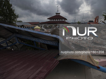 A collapsed mosque minaret is seen after a 6.5-magnitude earthquake struck the town of Pidie, Indonesia's Aceh province in northern Sumatra,...