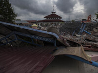 A collapsed mosque minaret is seen after a 6.5-magnitude earthquake struck the town of Pidie, Indonesia's Aceh province in northern Sumatra,...