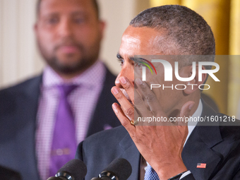 US President Barack Obama gets emotional as he speaks on reducing gun violence in the East Room of the White House on January 5, 2016 in Was...