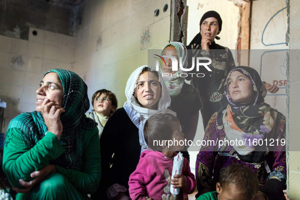 Syrian-Kurdish women wait for a visit from a volunteer doctor.
torbali, Turkey. March 2016. In the discrict of Izmir, in the western part o...