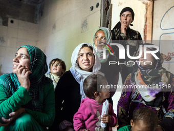 Syrian-Kurdish women wait for a visit from a volunteer doctor.
torbali, Turkey. March 2016. In the discrict of Izmir, in the western part o...