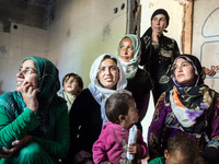 Syrian-Kurdish women wait for a visit from a volunteer doctor.
torbali, Turkey. March 2016. In the discrict of Izmir, in the western part o...