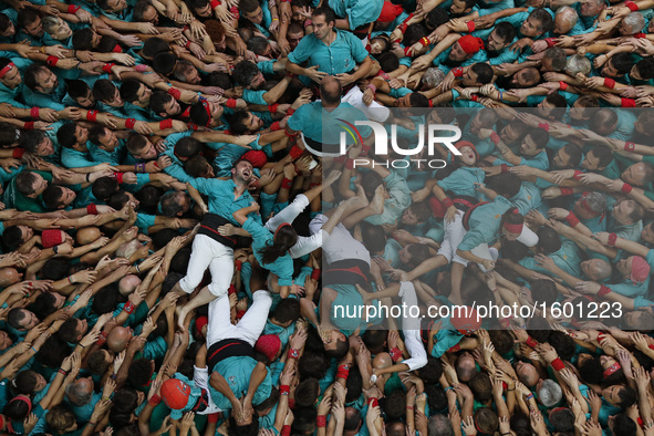 Members of a human tower group perform during the 26th Human Towers Competition in the old bullring of Tarragona, Spain, Oct. 2, 2016.