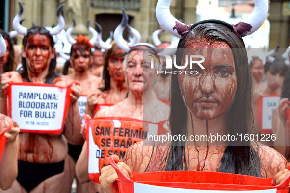 Activists From Around the World Descend on Pamplona's Main Square to Demand an End to Cruel Running of the Bulls on July 5, 2016. Wearing li...