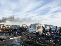 Workers destroy empty houses in the jungle. The representatives of the Prefecture ensures that no refugee is present, in Calais, October 27,...