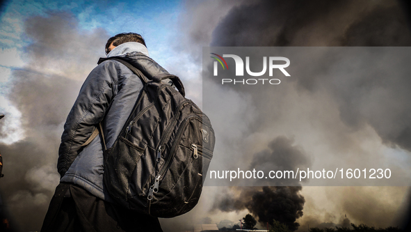 Fire takes hold in the notorious Jungle camp as migrants leave and the authorities demolish the site on October 26, 2016 in Calais, France....