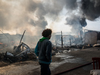 Chaotic scenes of the jungle as the camp is evacuated, because of the danger from all the fires in Calais, France on 26 October 2016. Around...