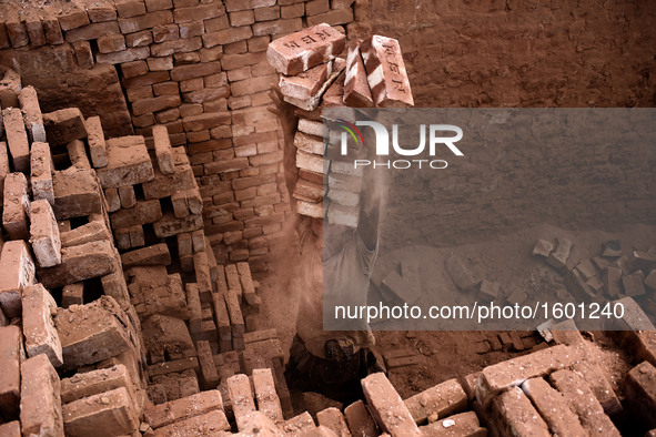 A laborer is working in a brickfield, in Dhaka, Bangladesh, on April 25, 2016. 