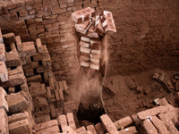 A laborer is working in a brickfield, in Dhaka, Bangladesh, on April 25, 2016. (