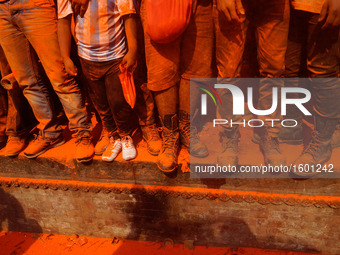 Devotees are seen covered with vermillion powder celebrating during the "Sindoor Jatra" vermillion powder festival at Thimi, in Bhaktapur, N...