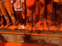 Devotees are seen covered with vermillion powder celebrating during the "Sindoor Jatra" vermillion powder festival at Thimi, in Bhaktapur, N...