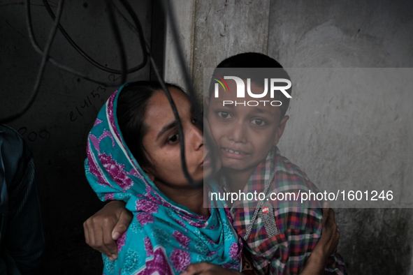 A terrified kid as the fire breaks out at the Korail Slum after the fire came in control at Dhaka, Bangladesh, 04 December 2016. The flames...