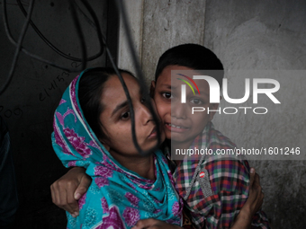 A terrified kid as the fire breaks out at the Korail Slum after the fire came in control at Dhaka, Bangladesh, 04 December 2016. The flames...