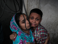 A terrified kid as the fire breaks out at the Korail Slum after the fire came in control at Dhaka, Bangladesh, 04 December 2016. The flames...